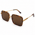 Gucci square sunglasses — tortoiseshell brown frame, gold-tone arms and brown lenses
